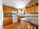 Well-lit kitchen with granite countertops, modern appliances, and ample cabinet storage at 20404 N 28Th Pl, Phoenix, AZ 85050
