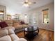 Bright living room with hardwood floors features a sliding glass door to the backyard at 20404 N 28Th Pl, Phoenix, AZ 85050