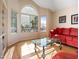 Bright living room with hardwood floors, a large window, and an inviting space to relax at 20404 N 28Th Pl, Phoenix, AZ 85050