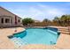 Inviting backyard pool with custom tile and desert landscaping, perfect for relaxing and entertaining at 20404 N 28Th Pl, Phoenix, AZ 85050