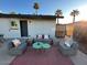 Relaxing back patio with comfortable seating, perfect for outdoor gatherings and enjoying the sunset at 2044 W 1St St, Mesa, AZ 85201