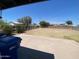 Large backyard featuring a concrete patio and ample open space, ready for personalization at 2044 W 1St St, Mesa, AZ 85201