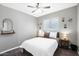 Cozy bedroom with neutral walls, decorative wall art, and a ceiling fan above a comfortable bed at 2044 W 1St St, Mesa, AZ 85201