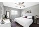 Serene bedroom with a ceiling fan, a desk area, and natural light at 2044 W 1St St, Mesa, AZ 85201