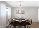 Bright dining room boasts modern lighting and seating for six at 2044 W 1St St, Mesa, AZ 85201