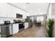 Spacious kitchen boasts stainless steel appliances and a view into the dining area at 2044 W 1St St, Mesa, AZ 85201
