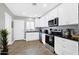 Well-lit kitchen features stainless steel appliances and ample cabinet space at 2044 W 1St St, Mesa, AZ 85201