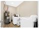 Functional laundry room featuring a washer, dryer, water heater and ample space for laundry tasks at 2044 W 1St St, Mesa, AZ 85201