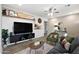 Modern living room features stylish decor, a ceiling fan, and wood-look flooring at 2044 W 1St St, Mesa, AZ 85201