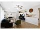 Open living room showcases a ceiling fan and seamless flow into the dining area at 2044 W 1St St, Mesa, AZ 85201