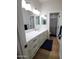 Bathroom featuring a single vanity with storage and a shower with tub at 2060 E Quartz St, Mesa, AZ 85213