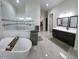 Elegant bathroom featuring a soaking tub, dual vanity, and a walk-in shower at 2060 E Quartz St, Mesa, AZ 85213
