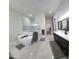 Bright bathroom with a modern tub, glass-enclosed shower, and double sink vanity at 2060 E Quartz St, Mesa, AZ 85213