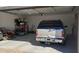 Organized garage with shelving and space for parking and storage at 2060 E Quartz St, Mesa, AZ 85213