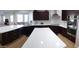 Modern kitchen featuring white countertop and dark cabinets at 2060 E Quartz St, Mesa, AZ 85213