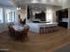 Inviting eat-in kitchen featuring white countertop, stainless steel appliances, dark cabinets and breakfast bar at 2060 E Quartz St, Mesa, AZ 85213