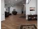 Spacious living room with wood floors, recessed lighting, and a ceiling fan to keep the house cool at 2060 E Quartz St, Mesa, AZ 85213