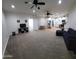 Open-concept living room flowing into a modern kitchen, great for entertaining at 2060 E Quartz St, Mesa, AZ 85213