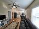 Open concept living room flowing into kitchen with natural light and modern fixtures at 2060 E Quartz St, Mesa, AZ 85213