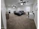 Spacious primary bedroom with neutral tones, ceiling fans, and an ensuite bathroom at 2060 E Quartz St, Mesa, AZ 85213