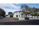 Rear exterior of a residence showcasing the garages, lawn, and home at 2060 E Quartz St, Mesa, AZ 85213