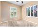 Bedroom with tan carpet and plantation shutters for natural light at 21401 E Russet Rd, Queen Creek, AZ 85142