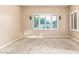 Bright, carpeted room with shuttered windows and neutral walls, ready for personalization and decor at 21401 E Russet Rd, Queen Creek, AZ 85142