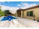 Sparkling pool with basketball hoop and covered patio, perfect for outdoor entertaining and relaxation at 21401 E Russet Rd, Queen Creek, AZ 85142