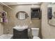 Bathroom featuring a tub/shower combo, vanity sink with cabinets, and a medicine cabinet mirror at 2201 W Wethersfield Rd, Phoenix, AZ 85029