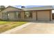 Charming single story home with low maintenance front yard, attached garage, and neutral color palette at 2201 W Wethersfield Rd, Phoenix, AZ 85029
