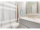 Cozy bathroom featuring a granite countertop vanity and tiled shower with curtain at 2641 E Binner Dr, Chandler, AZ 85225
