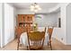 Cozy dining room featuring vintage furniture, a round table with a checkered tablecloth, and a charming chandelier at 2641 E Binner Dr, Chandler, AZ 85225