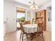 Bright dining room with vintage furniture, a sliding glass door to the backyard, and a decorative chandelier at 2641 E Binner Dr, Chandler, AZ 85225