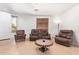 Inviting living room with tile flooring, comfortable seating arrangements, and ample natural light through a window at 2641 E Binner Dr, Chandler, AZ 85225