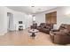 Bright living room showcasing tile floors, a desk, and comfortable furniture with neutral colors and a ceiling light at 2641 E Binner Dr, Chandler, AZ 85225