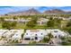 Aerial view featuring the home's desert community, golf course, and surrounding mountains at 2737 E Arizona Biltmore Cir # 8, Phoenix, AZ 85016