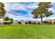 Expansive backyard with lush green grass and trees, featuring the surrounding community at 2737 E Arizona Biltmore Cir # 8, Phoenix, AZ 85016