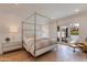 Elegant bedroom with a four-poster bed, outdoor access and views of the private patio at 2737 E Arizona Biltmore Cir # 8, Phoenix, AZ 85016