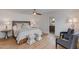 This primary bedroom features a ceiling fan, wood flooring, and ensuite bathroom at 2737 E Arizona Biltmore Cir # 8, Phoenix, AZ 85016