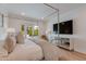 Cozy bedroom with backyard views, modern decor, and light hardwood floors at 2737 E Arizona Biltmore Cir # 8, Phoenix, AZ 85016