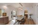 Dining room features light fixture, decorative fruit bowl, and access to an adjoining kitchen at 2737 E Arizona Biltmore Cir # 8, Phoenix, AZ 85016