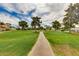 Beautiful view of the golf course, featuring a path, mature trees, and lush green grass at 2737 E Arizona Biltmore Cir # 8, Phoenix, AZ 85016