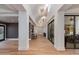 A long hallway boasts hardwood floors, recessed lighting, and modern architectural design at 2737 E Arizona Biltmore Cir # 8, Phoenix, AZ 85016