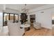 Bright living room with hardwood floors, stylish chairs, modern lighting, and fireplace at 2737 E Arizona Biltmore Cir # 8, Phoenix, AZ 85016