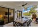 Covered patio with ceiling fan, patio furniture, and views of the beautiful backyard and pool at 2737 E Arizona Biltmore Cir # 8, Phoenix, AZ 85016