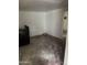 Unfinished kitchen with black appliances and visible wear, providing a renovation opportunity at 2825 E Adams St, Phoenix, AZ 85034
