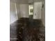 Empty room ready for renovations, featuring bare walls and floor, perfect for customization at 2825 E Adams St, Phoenix, AZ 85034