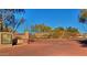 Terra Vista community gate with brick-paved entrance, desert landscaping, and clear blue sky at 29606 N Tatum Blvd # 204, Cave Creek, AZ 85331