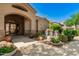 Welcoming community center entrance with a charming water feature and manicured landscaping at 29606 N Tatum Blvd # 204, Cave Creek, AZ 85331