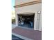 Open garage showing storage shelves, tools, and ample space for parking at 29606 N Tatum Blvd # 204, Cave Creek, AZ 85331